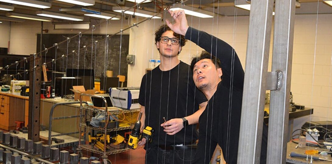 Students working on a bridge